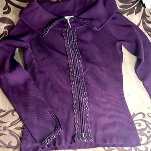 Maroon colored evening sweater with dual zippers.